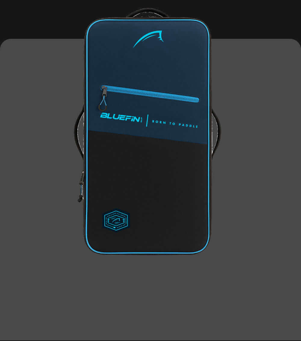 Bluefin paddleboard bag in navy and black with a front zipper and logo, designed for carrying gear.