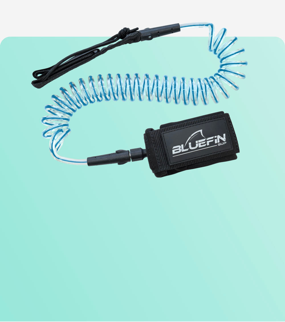 Coiled safety leash with black strap and BLUEFIN SUP logo, attached to a blue cord.