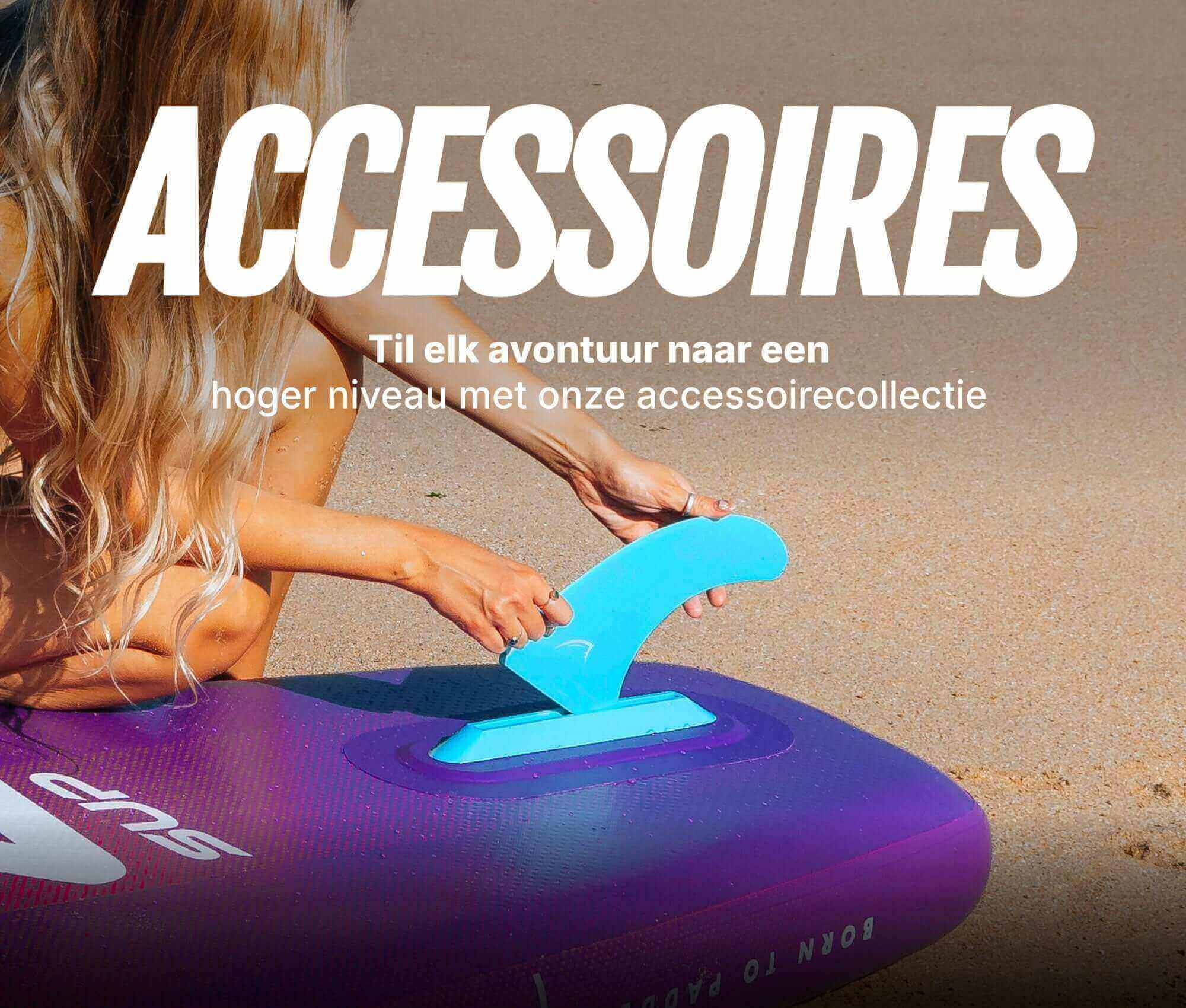 Inflatable paddleboard with a blue fin being attached, sandy beach in the background