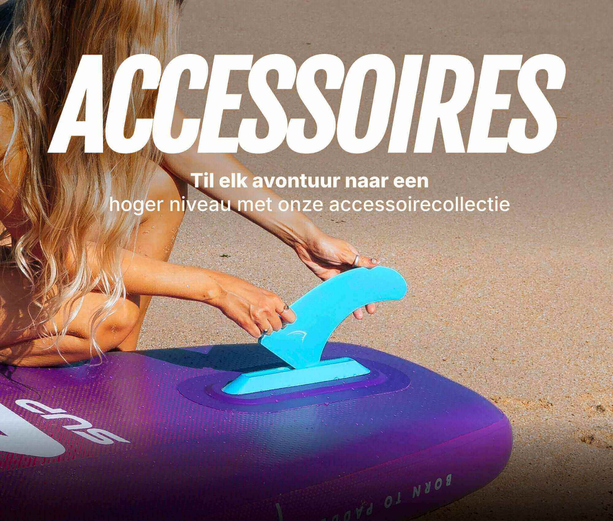 Inflatable paddleboard with a blue fin being attached, sandy beach in the background