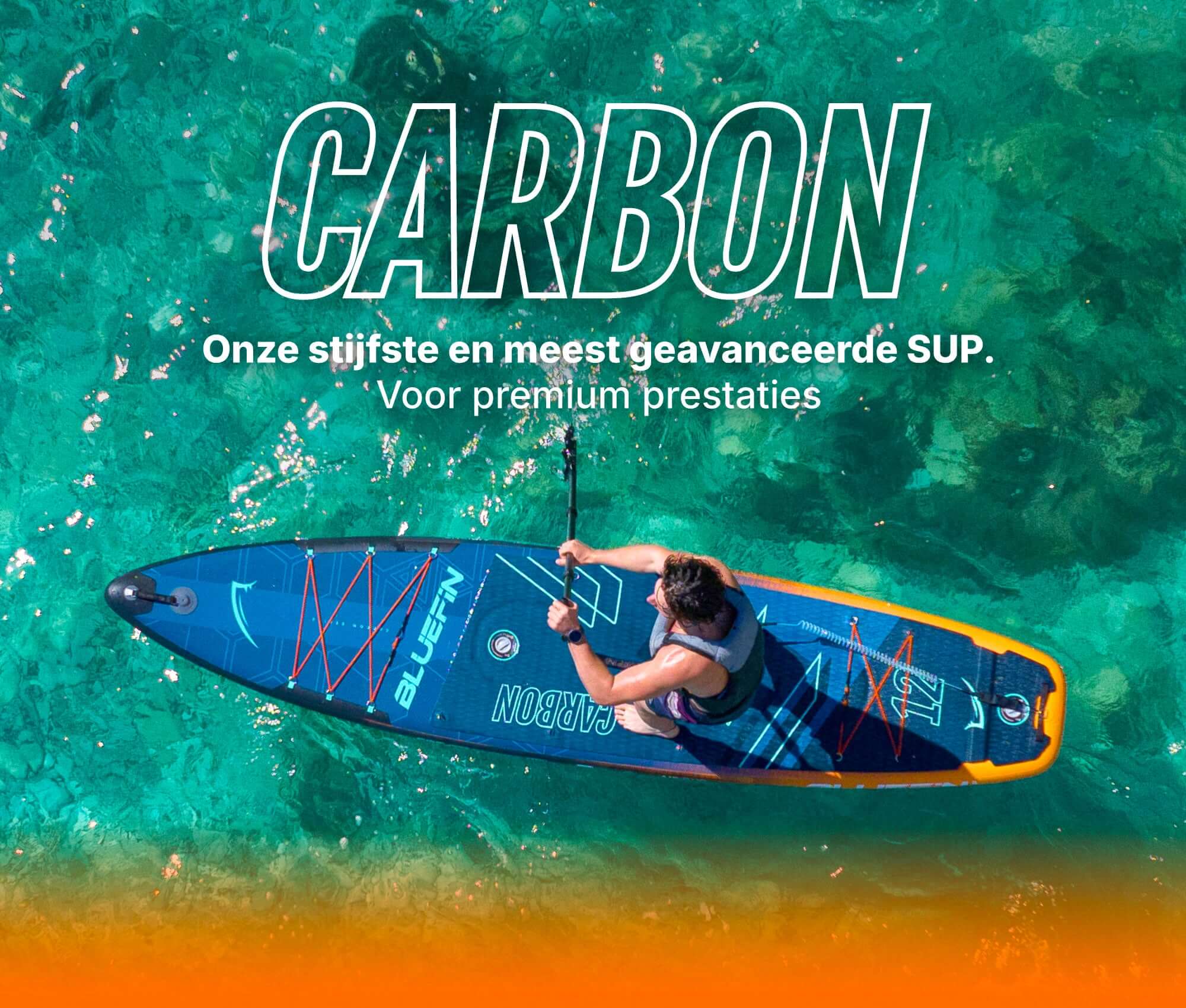 Inflatable paddleboard with blue design, center fin, and textured deck pad on clear water