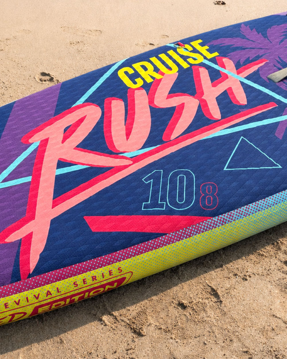 Inflatable paddleboard with colorful graphics, featuring the text 'CRUISE RUSH 10 8' and a textured surface.