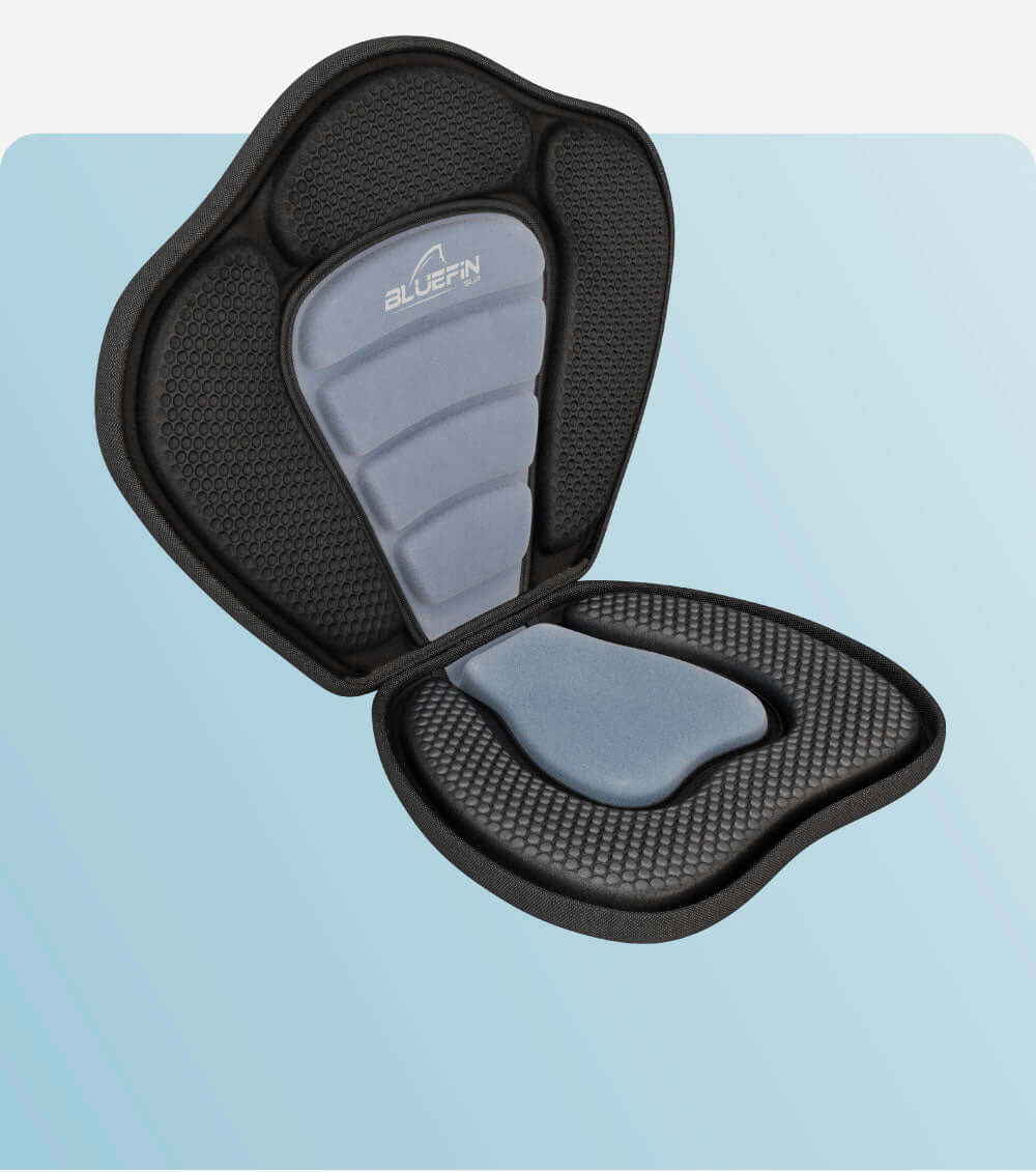 Bluefin SUP seat cushion with ergonomic design, gray padding, and textured black outer layer.