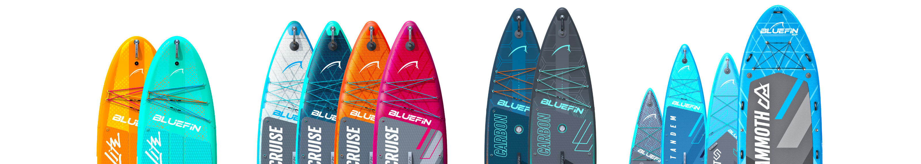 Colorful inflatable paddleboards with textured decks, fins, and bungee cords for storage.